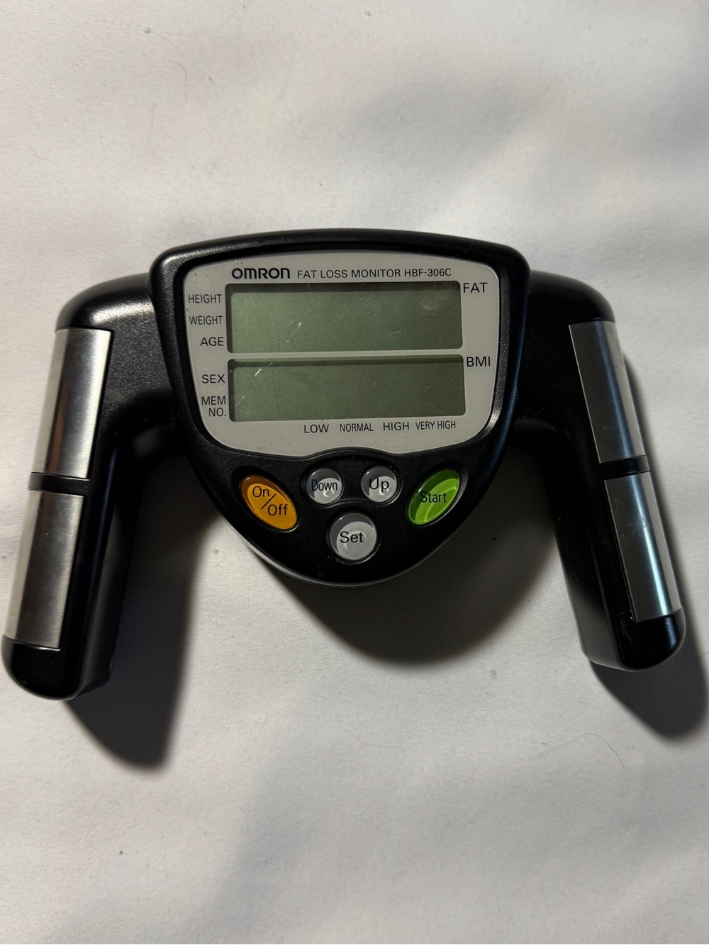 OMRON Black Body Fat Loss Monitor with Silver Handles and Green Button